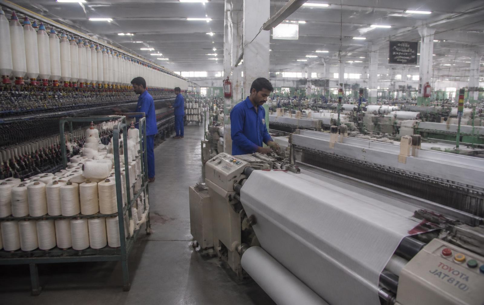 Spinning and weaving hall in a Pakistani textile mill